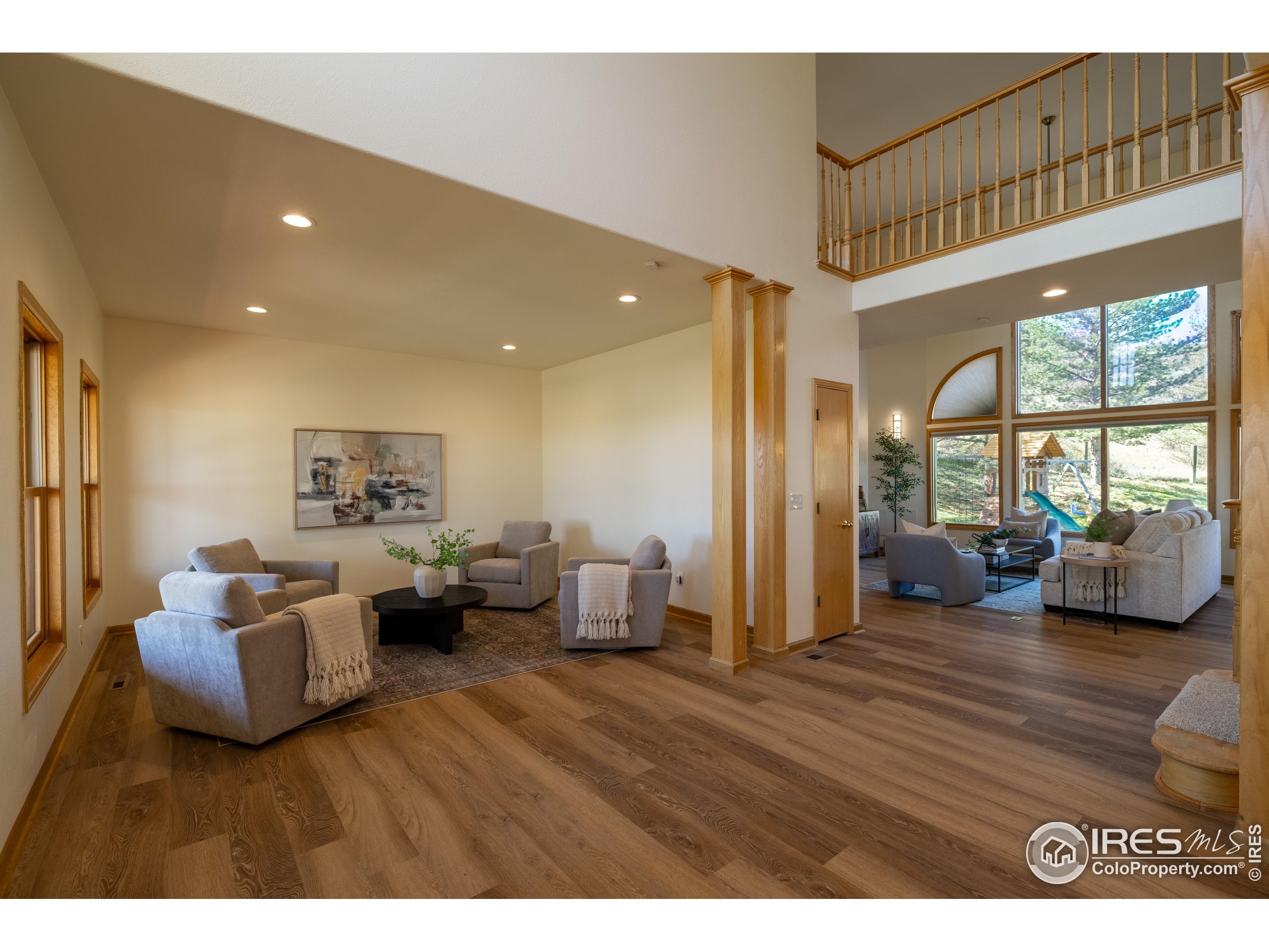 6465 Hidden Springs Road Fort Collins, CO 80526 - Photo 9 of 50 a living room with furniture and a large window