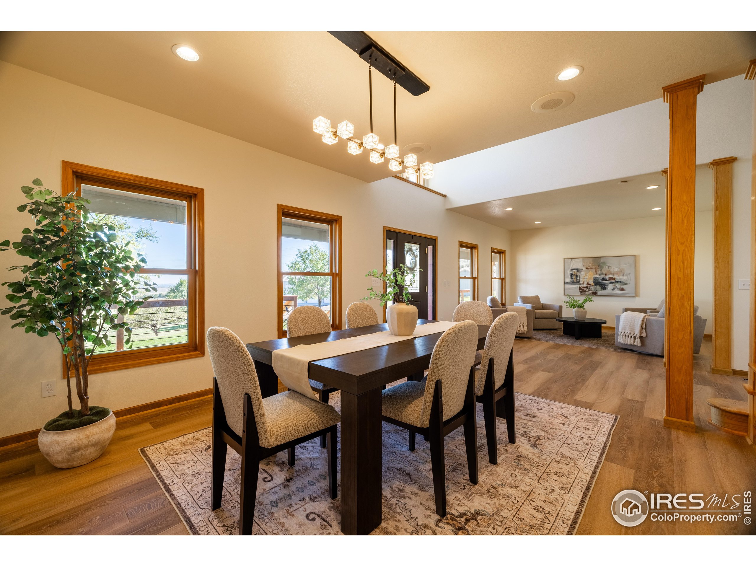 6465 Hidden Springs Road Fort Collins, CO 80526 - Photo 10 of 50 a view of a dining room with furniture and wooden floor