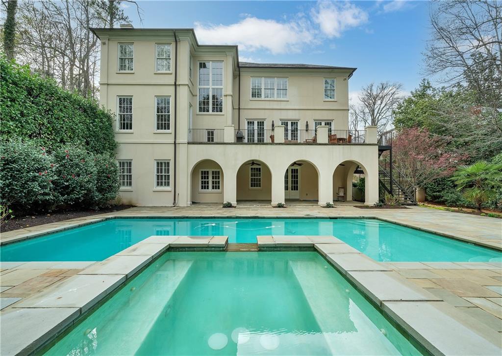 3147 Habersham Road Northwest Atlanta, GA 30305 - Photo 1 of 1 a house with swimming pool in front of it
