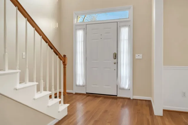 a view of front door with wooden floor