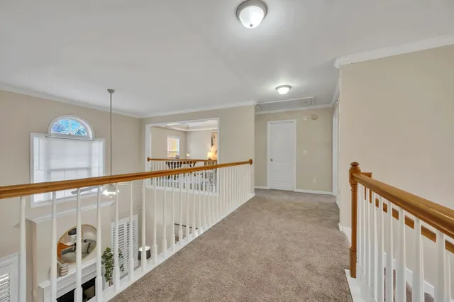 a view of a hallway with stairs