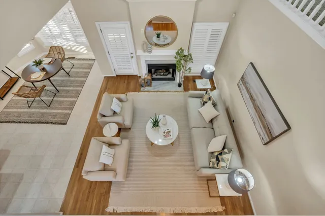 a living room with furniture and a fireplace