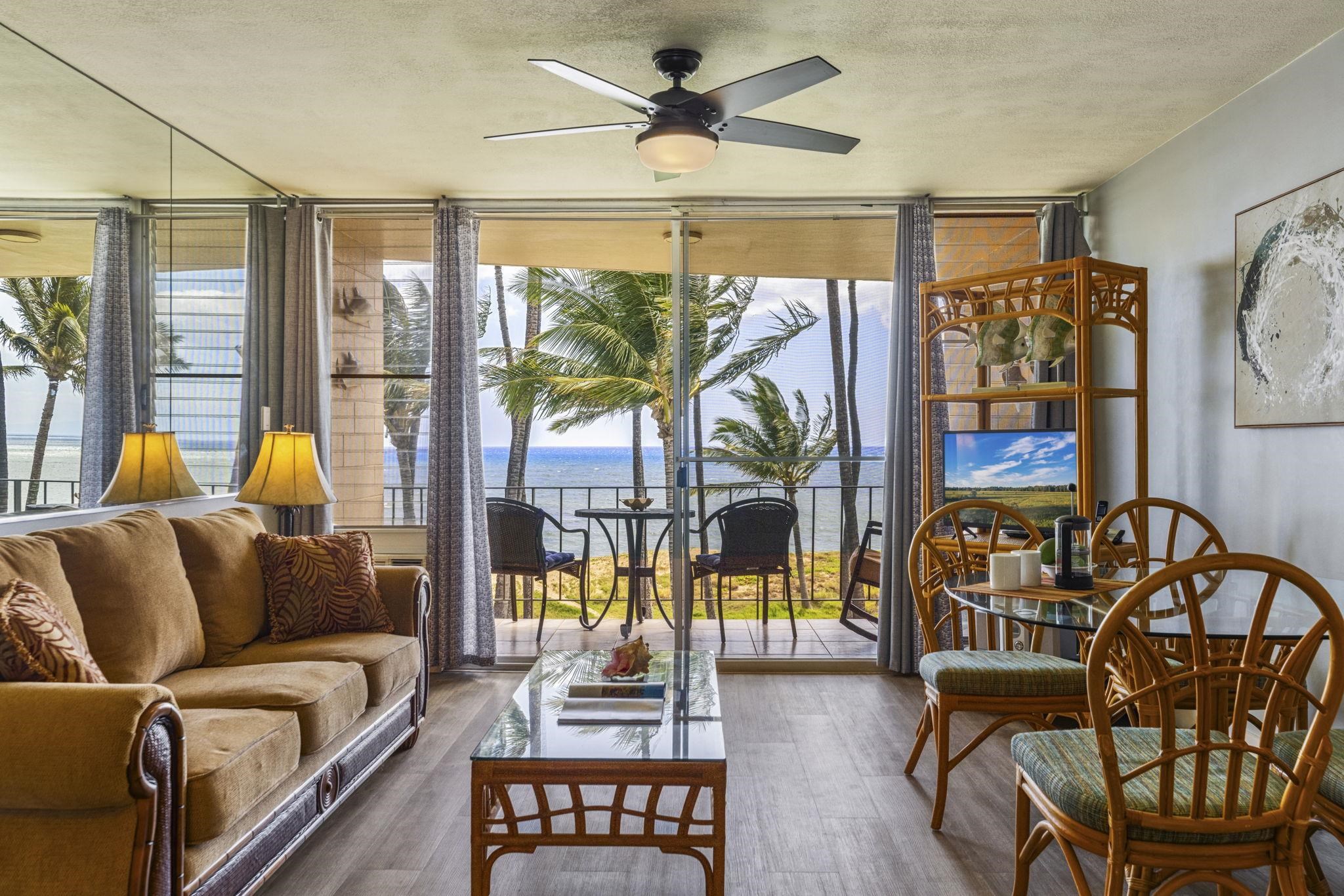 1310 Uluniu Road, Unit 317 Kihei, HI 96753 - Photo 11 of 50 a living room with furniture and a large window