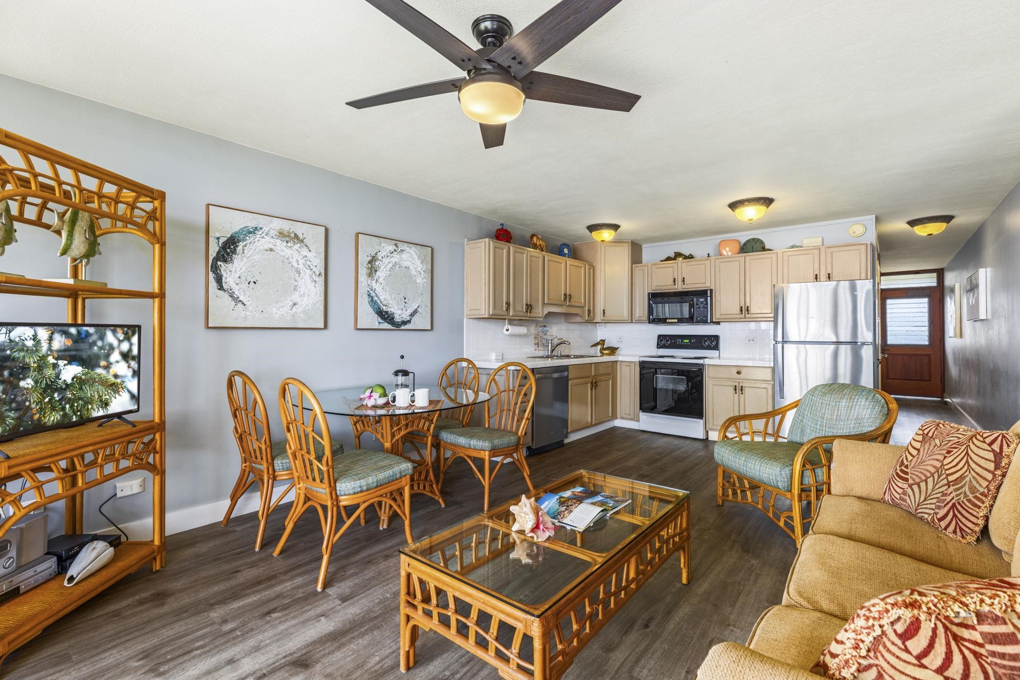 1310 Uluniu Road, Unit 317 Kihei, HI 96753 - Photo 20 of 50 a living room with furniture kitchen view and a window