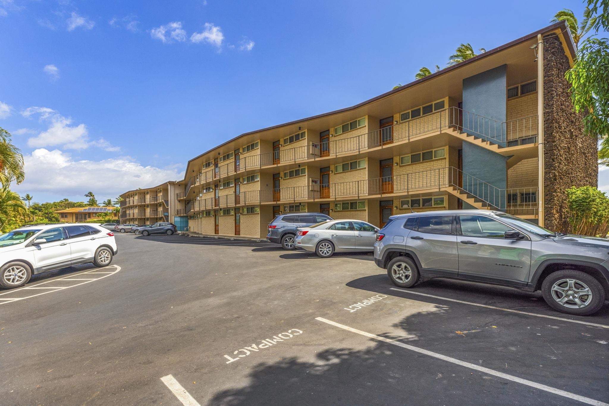 1310 Uluniu Road, Unit 317 Kihei, HI 96753 - Photo 38 of 50 a car parked in front of a house