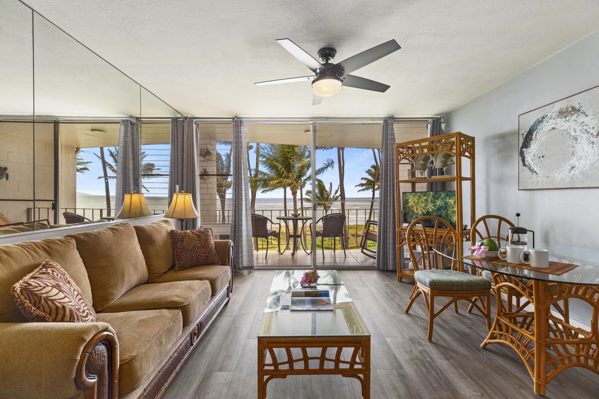 1310 Uluniu Road, Unit 317 Kihei, HI 96753 - Photo 8 of 50 a living room with furniture and a large window