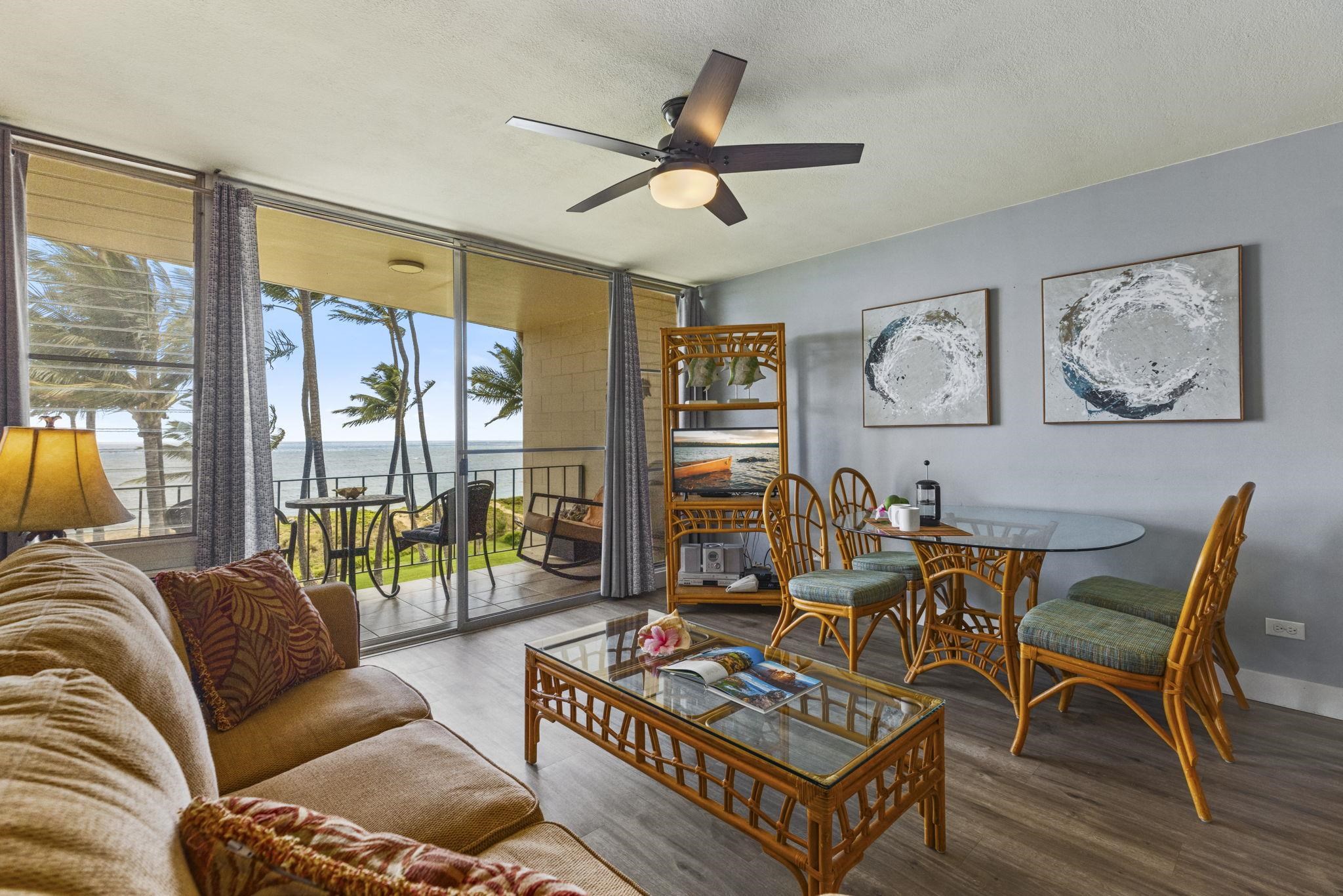 1310 Uluniu Road, Unit 317 Kihei, HI 96753 - Photo 10 of 50 a living room with furniture a rug and a large window
