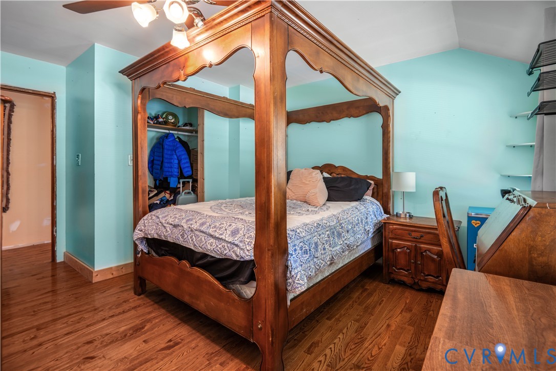 6243 Studley Road Mechanicsville, VA 23116 - Photo 47 of 65 a bedroom with a bed and wooden floor