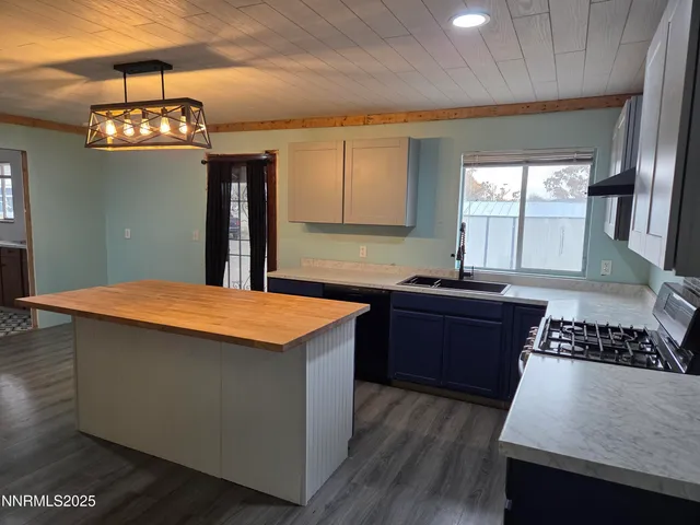 a kitchen with a stove and a refrigerator