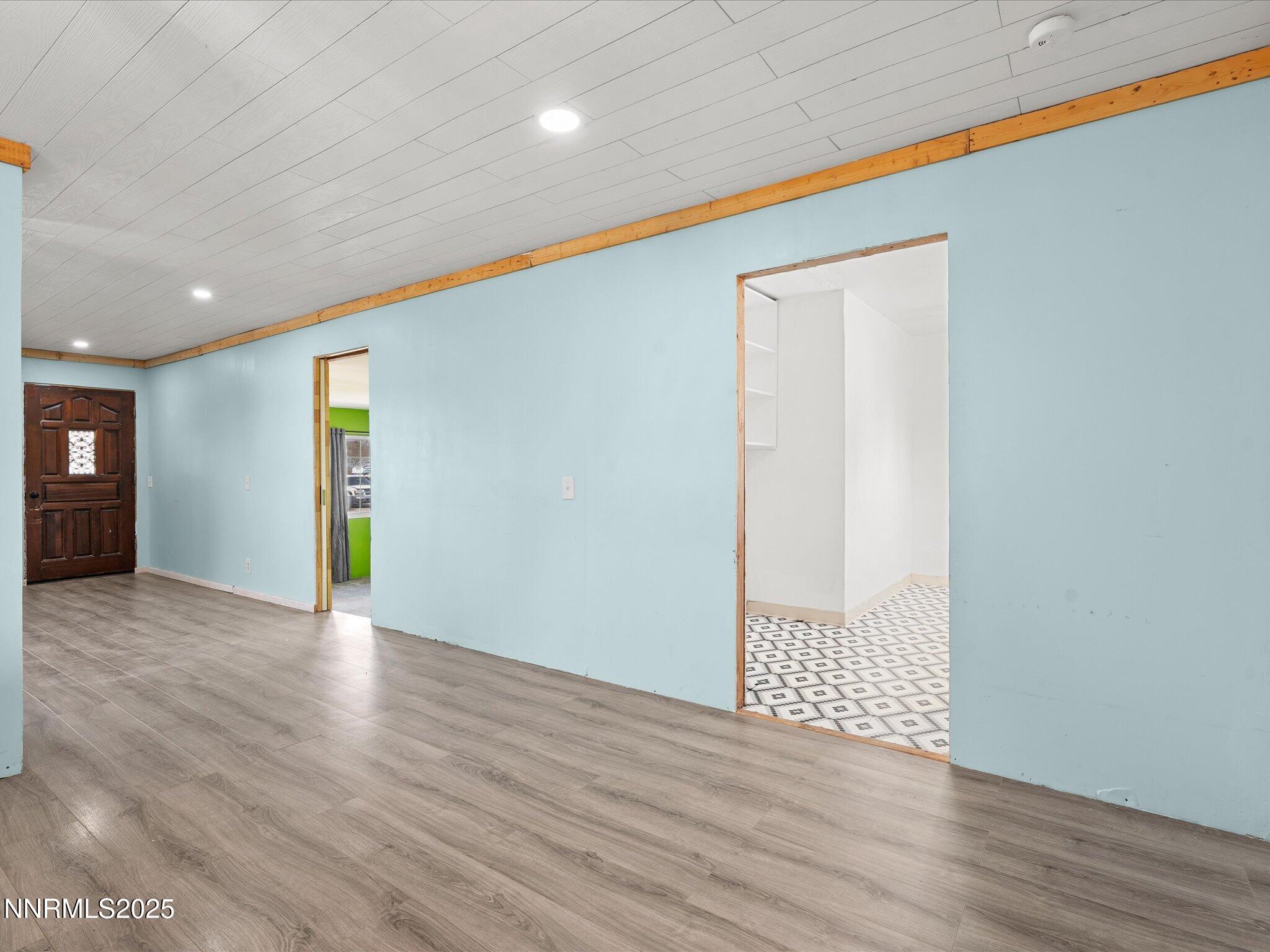845 Mc Lean Street Fallon, NV 89406 - Photo 14 of 23 a view of an empty room with wooden floor