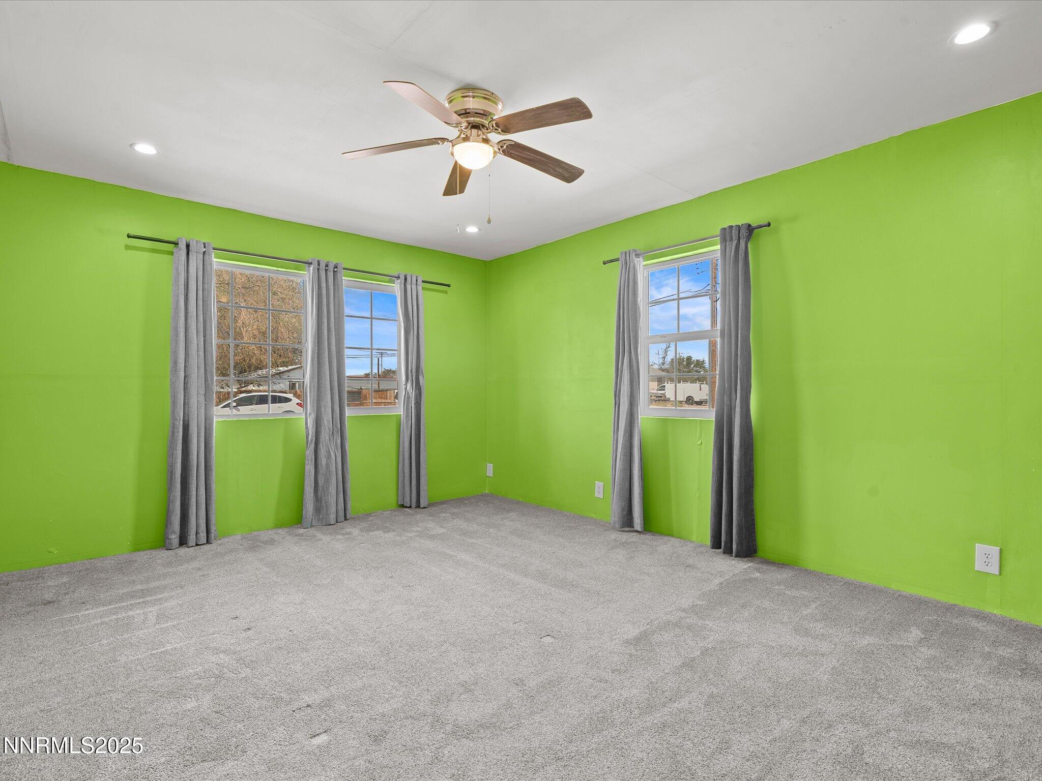 845 Mc Lean Street Fallon, NV 89406 - Photo 16 of 23 a view of a big room with windows and chandelier