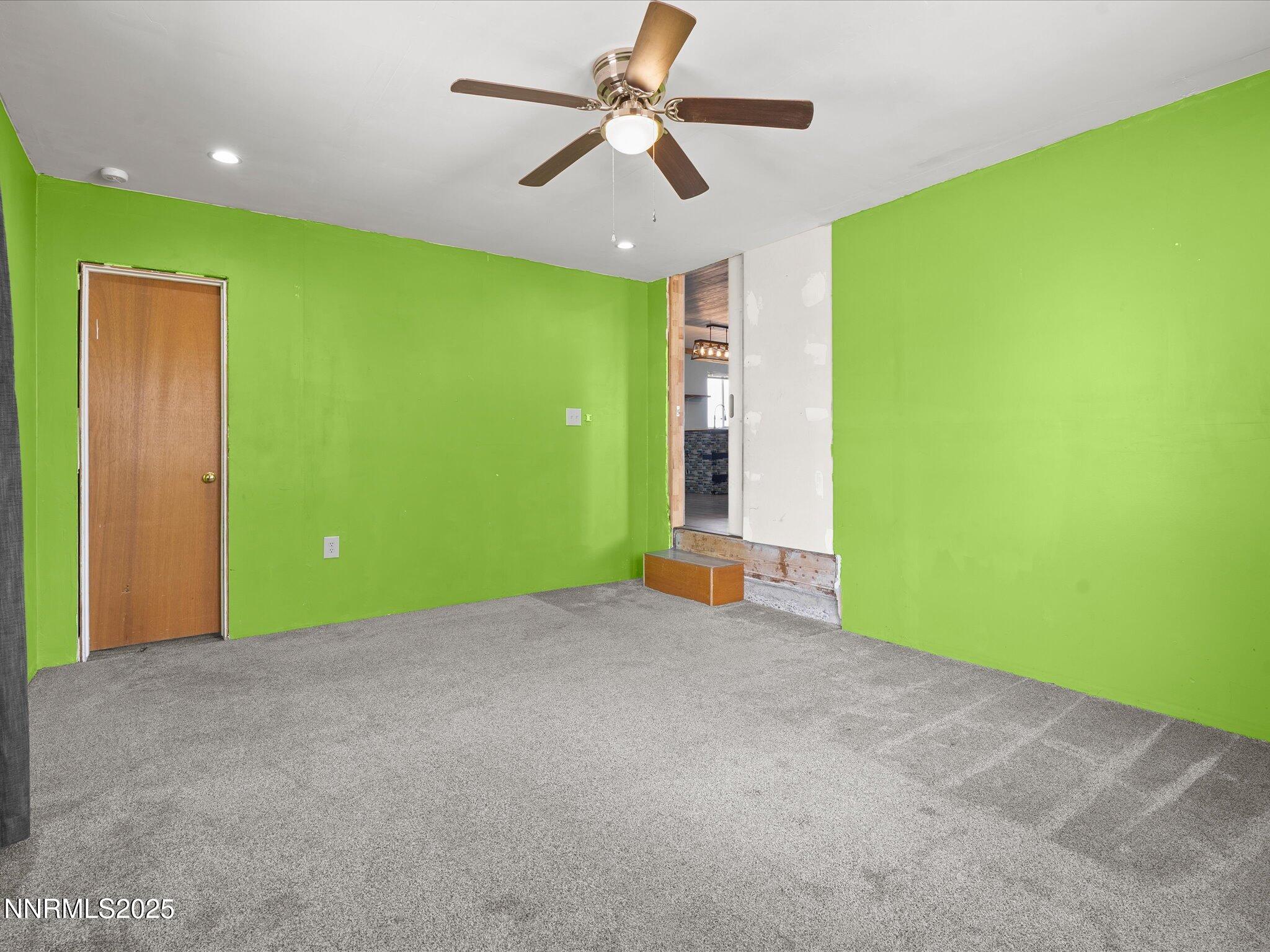 845 Mc Lean Street Fallon, NV 89406 - Photo 17 of 23 a view of a big room with potted plants and a ceiling fan