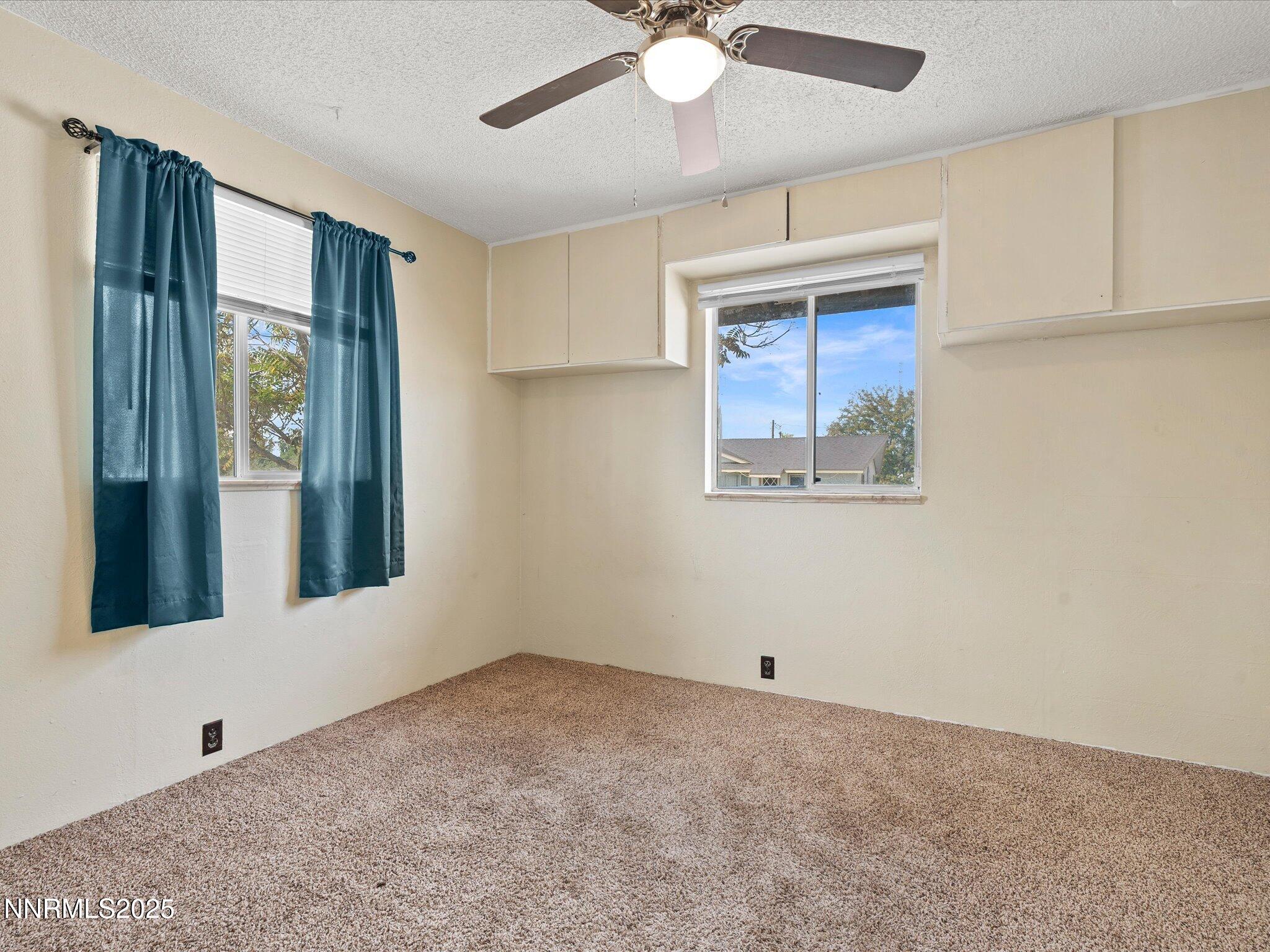845 Mc Lean Street Fallon, NV 89406 - Photo 21 of 23 a view of an empty room with window