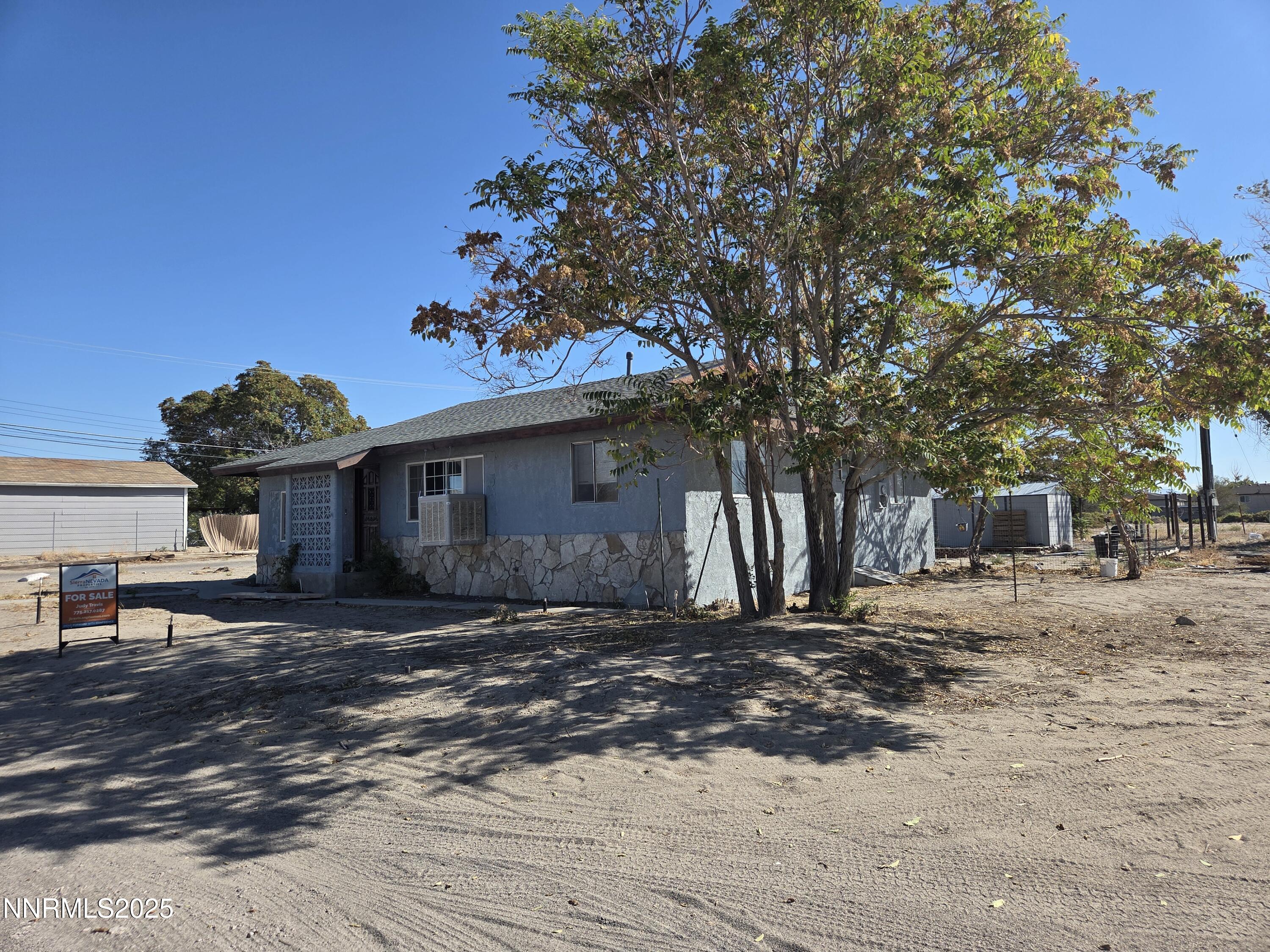 845 Mc Lean Street Fallon, NV 89406 - Photo 3 of 23 a front view of a house with a yard