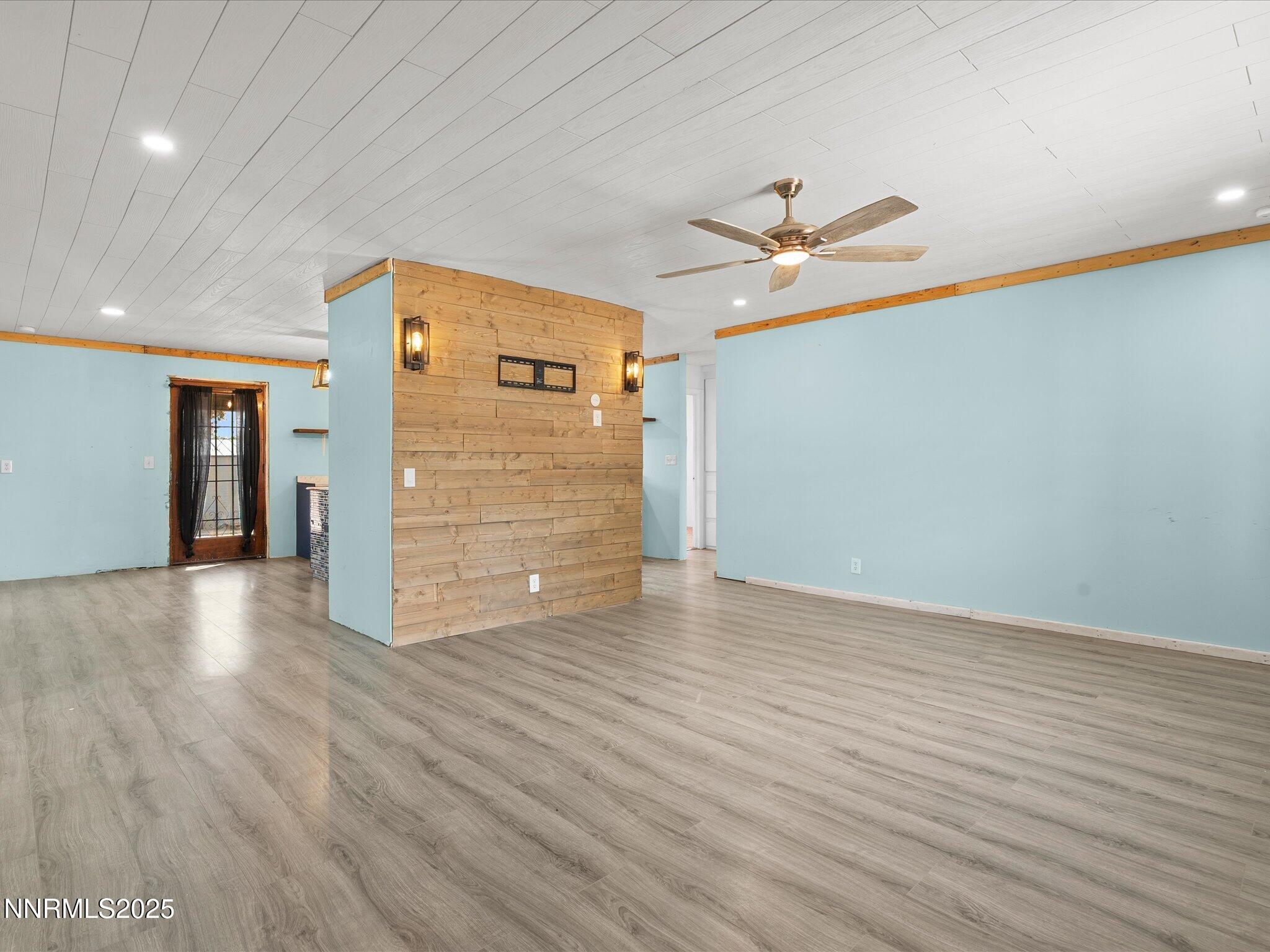 845 Mc Lean Street Fallon, NV 89406 - Photo 6 of 23 wooden floor in an empty room with a window