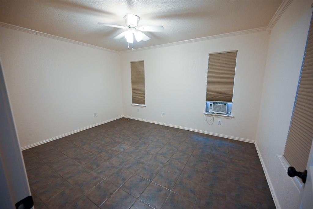 3201 South Garland Street Decatur, TX 76234 - Photo 9 of 20 an empty room with a view of a house