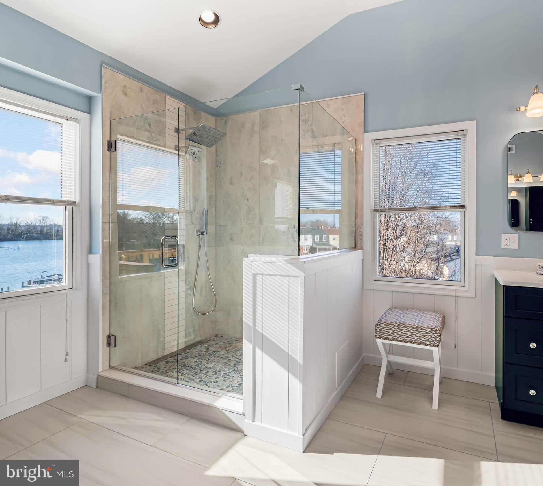 8101 Shore Road Baltimore, MD 21222 - Photo 14 of 35 a bathroom with a sink a toilet and shower