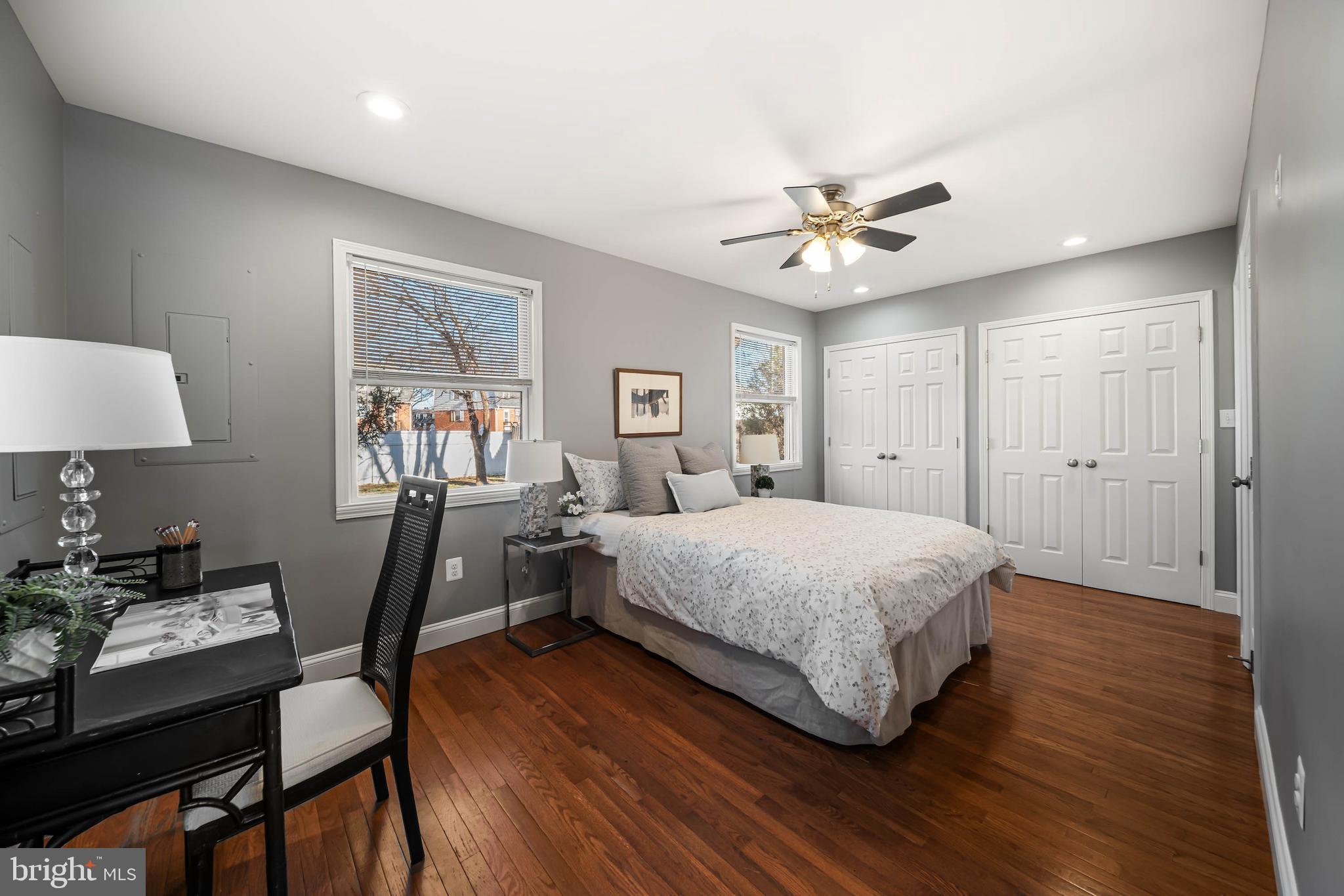 8101 Shore Road Baltimore, MD 21222 - Photo 25 of 35 a spacious bedroom with a bed and a table in it