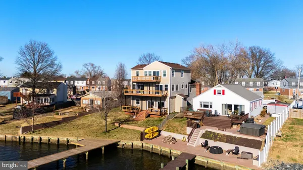 a aerial view of a house with swimming pool and sitting area