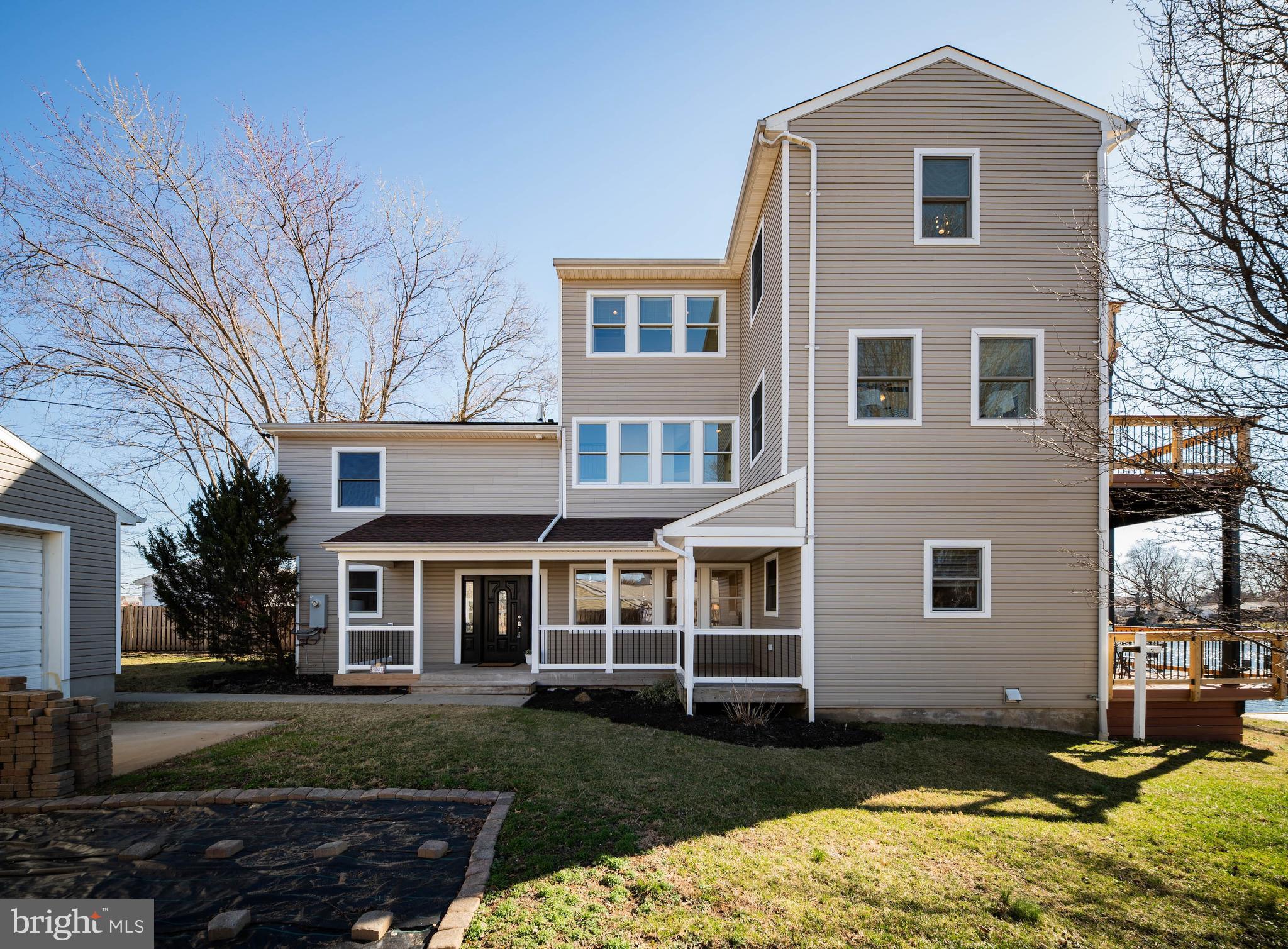 8101 Shore Road Baltimore, MD 21222 - Photo 33 of 35 a front view of a house with a yard