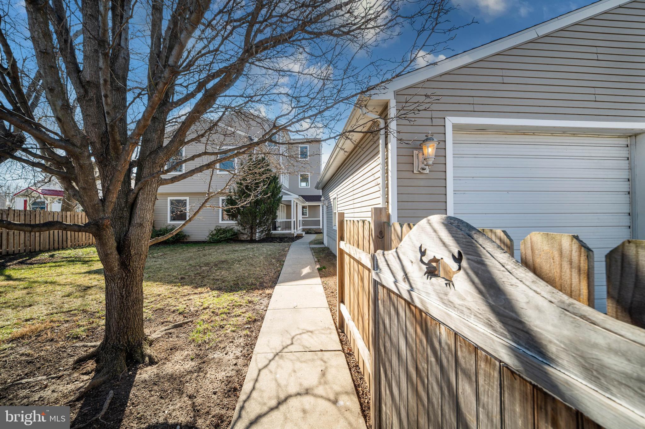 8101 Shore Road Baltimore, MD 21222 - Photo 4 of 35 a view of a house with backyard and trees