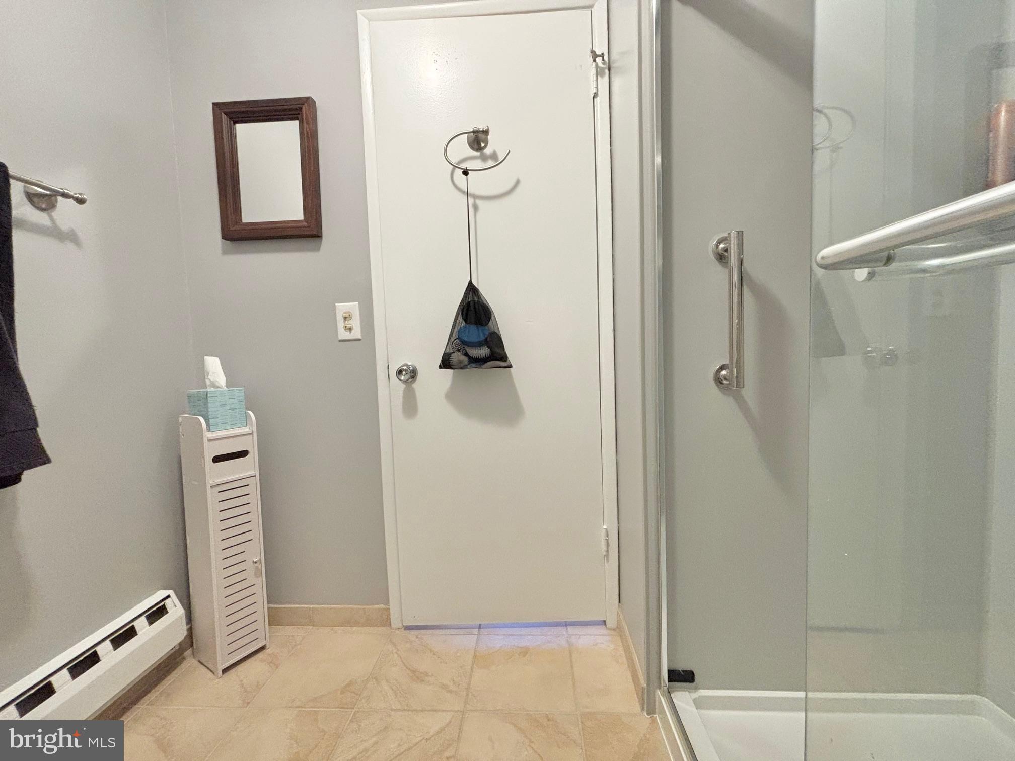 15111 Glade Drive, Unit 123D Silver Spring, MD 20906 - Photo 15 of 23 a bathroom with a shower