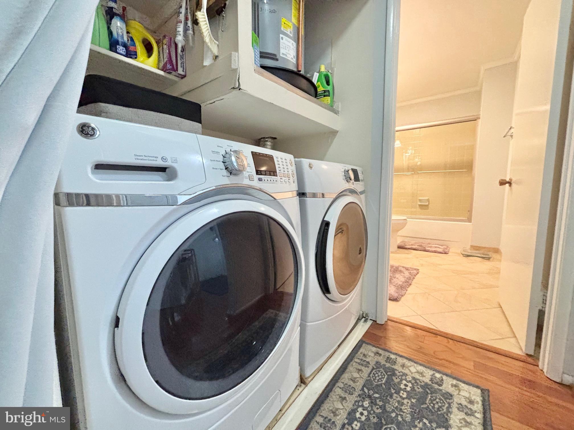15111 Glade Drive, Unit 123D Silver Spring, MD 20906 - Photo 18 of 23 a utility room with dryer and washer