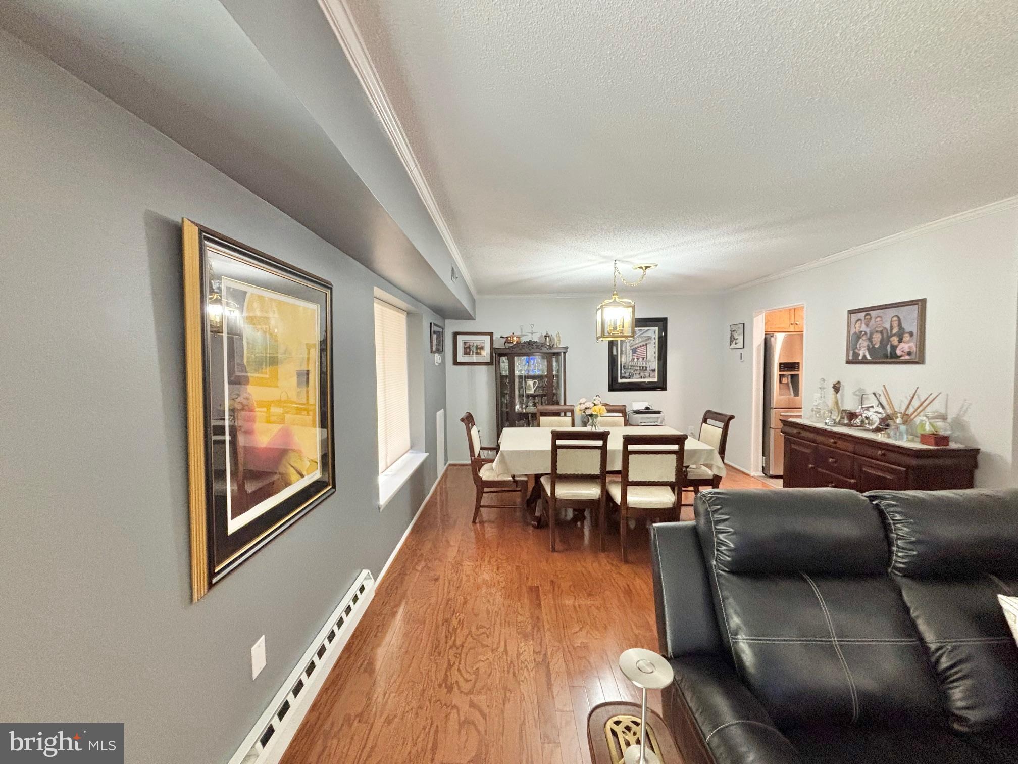 15111 Glade Drive, Unit 123D Silver Spring, MD 20906 - Photo 6 of 23 a living room with furniture and a table