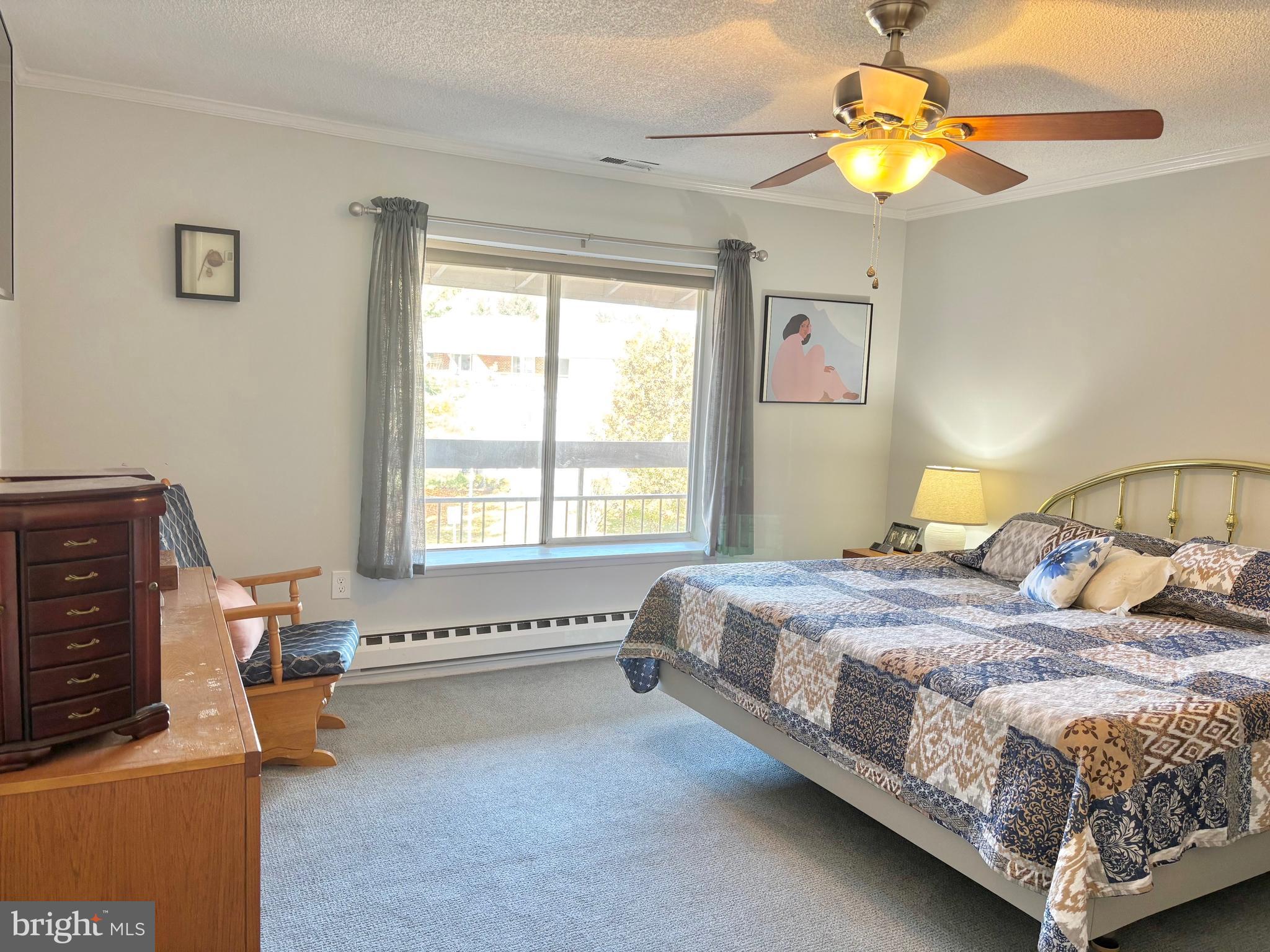 15111 Glade Drive, Unit 123D Silver Spring, MD 20906 - Photo 9 of 23 a bedroom with a bed and a window