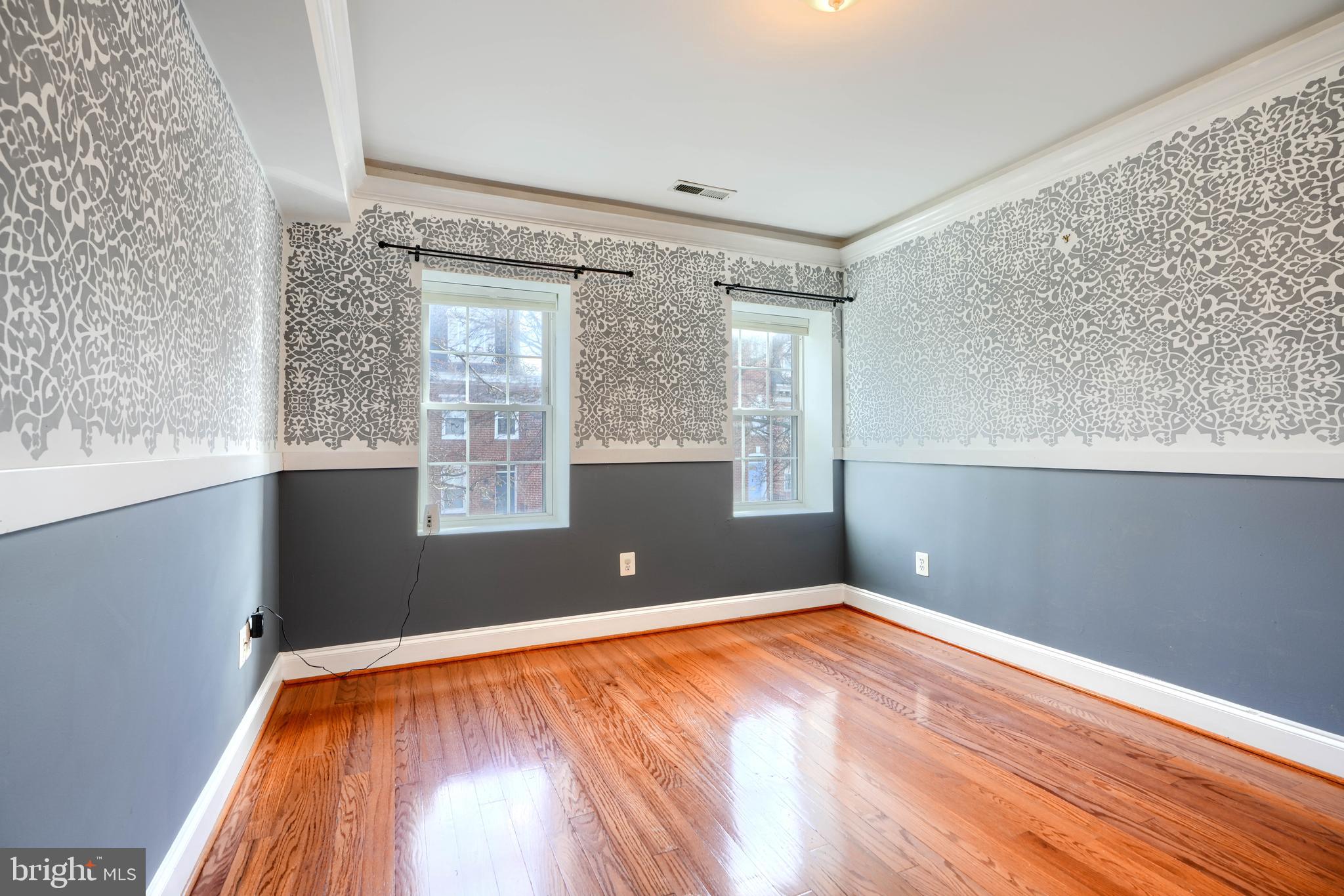 1520 Byrd Street Baltimore, MD 21230 - Photo 22 of 36 a view of empty room with wooden floor and fan