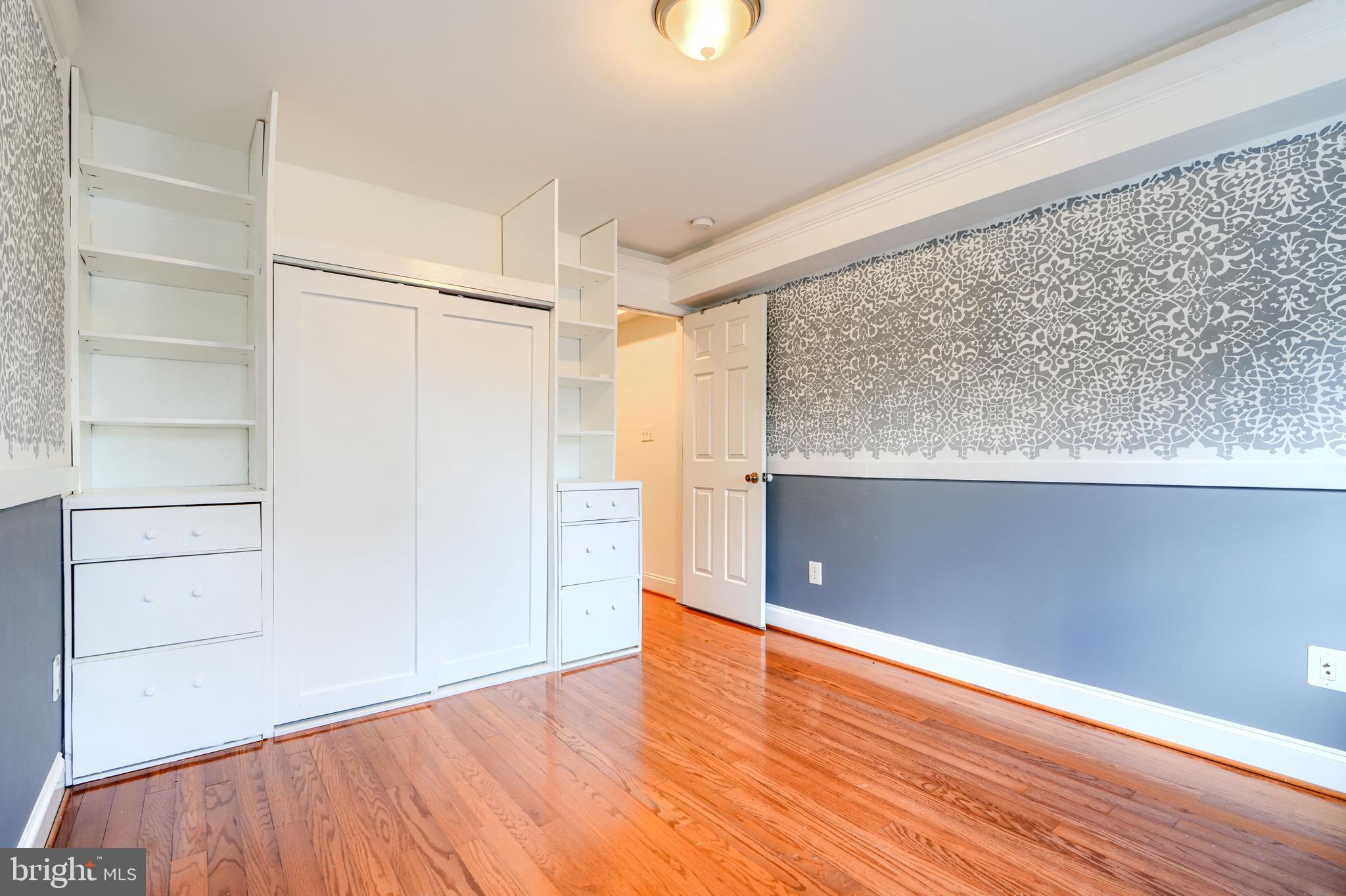 1520 Byrd Street Baltimore, MD 21230 - Photo 24 of 36 a view of an empty room with wooden floor and a window
