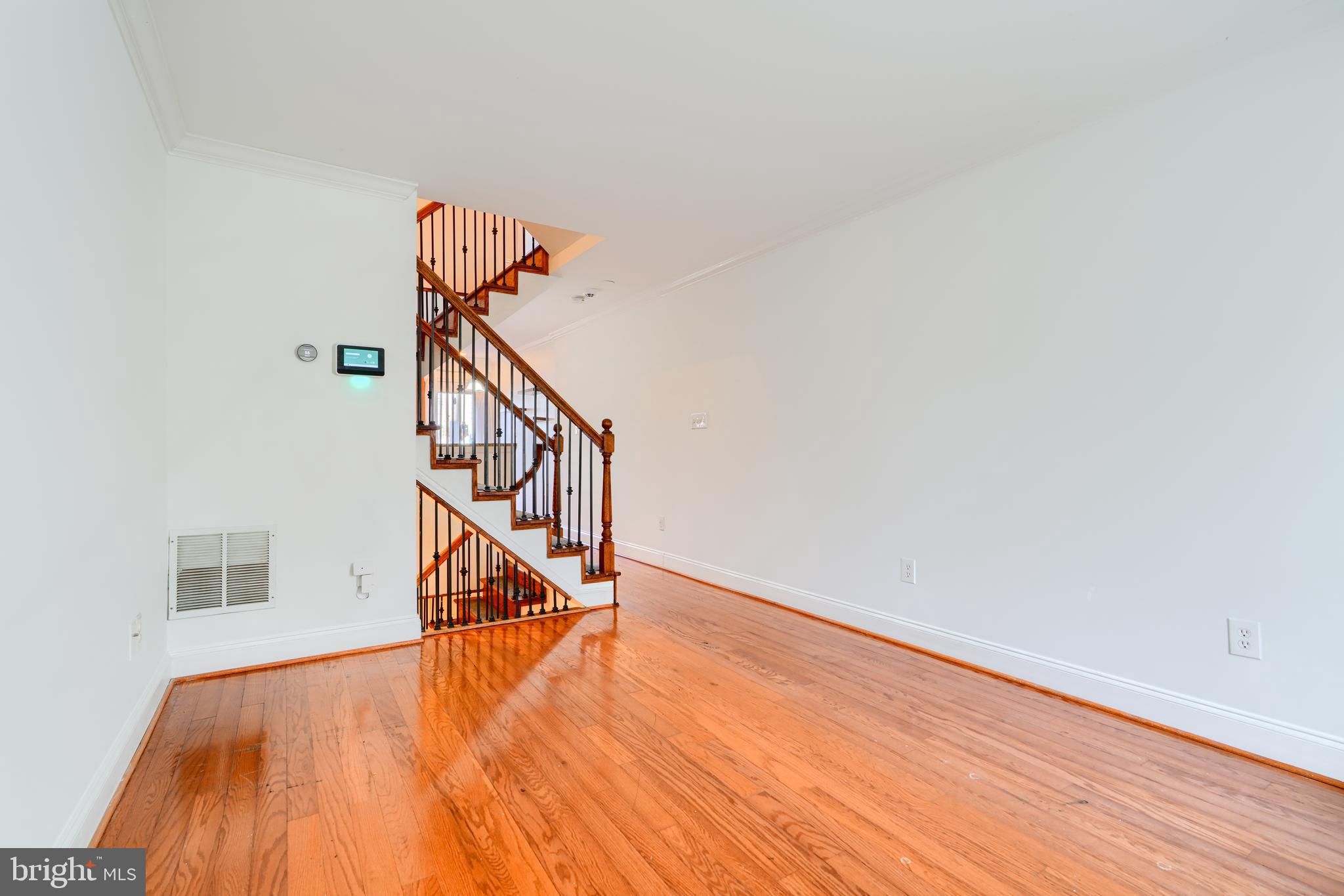 1520 Byrd Street Baltimore, MD 21230 - Photo 3 of 36 a view of entryway and hall with wooden floor