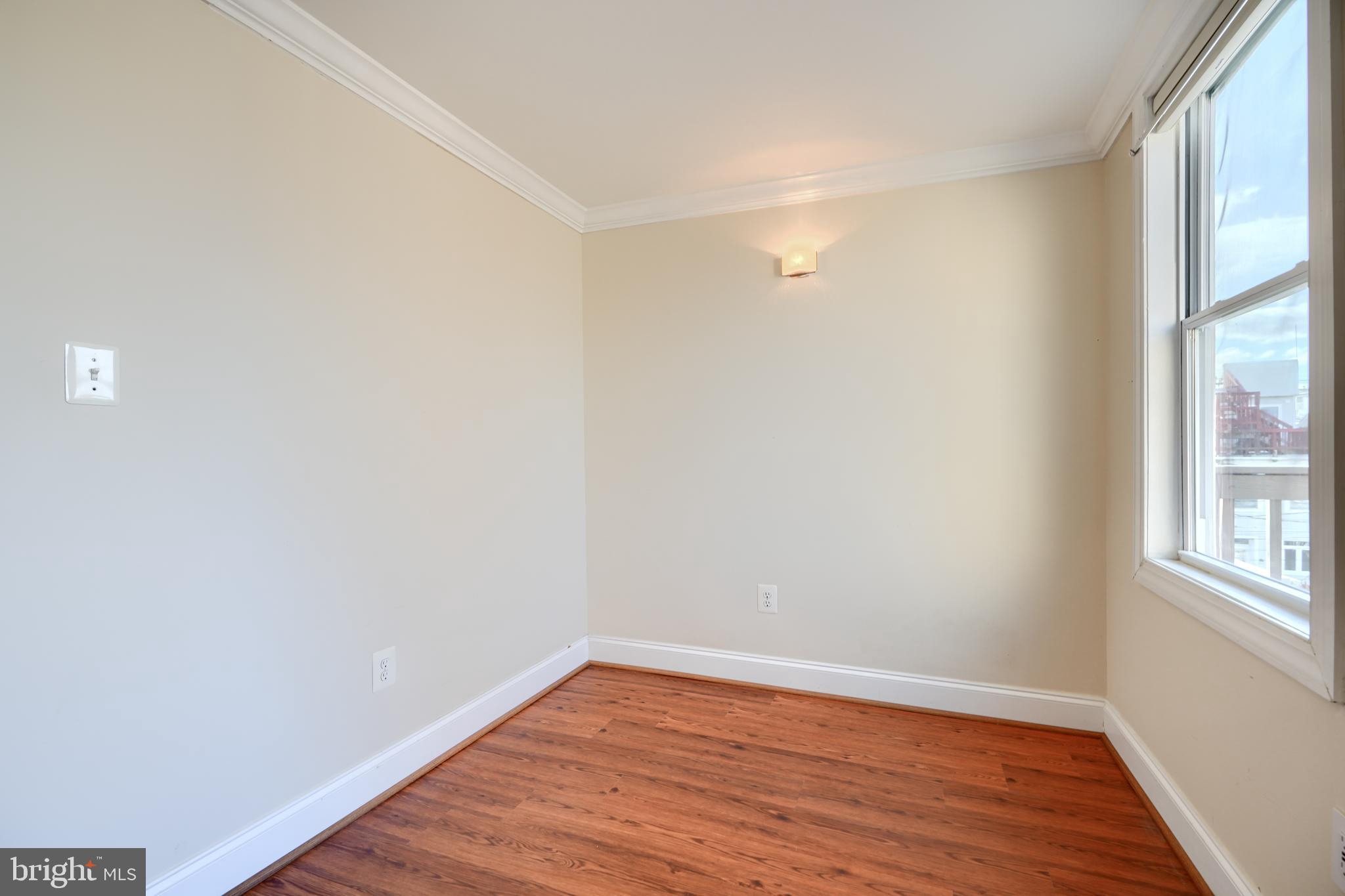 1520 Byrd Street Baltimore, MD 21230 - Photo 33 of 36 a view of a room with wooden floor and windows