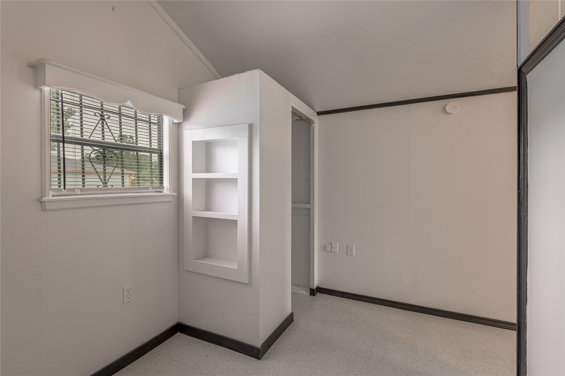 128 Johnnie Street Trinity, TX 75862 - Photo 14 of 19 a view of an empty room with a window