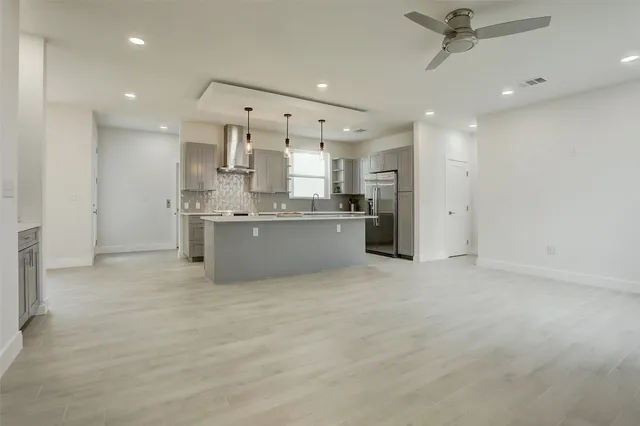 a large kitchen with cabinets and a stainless steel appliances