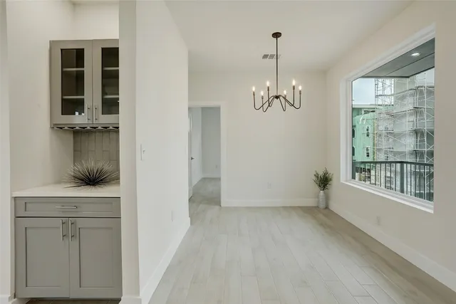 a view of a kitchen with a refrigerator a sink a dishwasher and a refrigerator