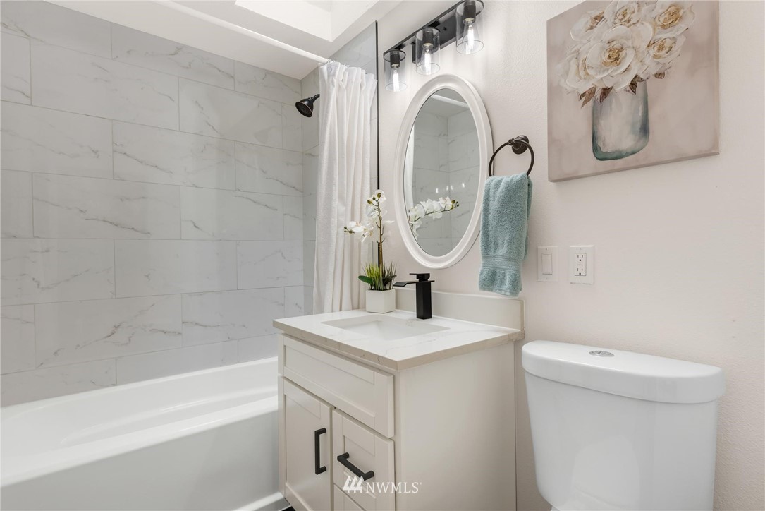 11519 32nd Avenue Northeast Seattle, WA 98125 - Photo 12 of 17 a bathroom with a sink a toilet and shower