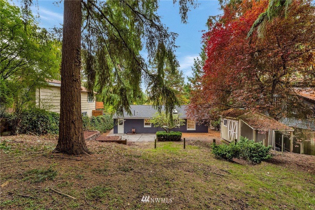 11519 32nd Avenue Northeast Seattle, WA 98125 - Photo 15 of 17 a view of a house with backyard and sitting area