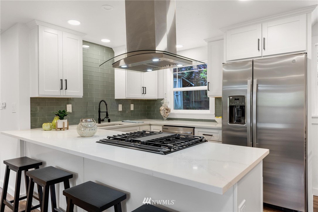 11519 32nd Avenue Northeast Seattle, WA 98125 - Photo 7 of 17 a kitchen with a stove a refrigerator and a sink