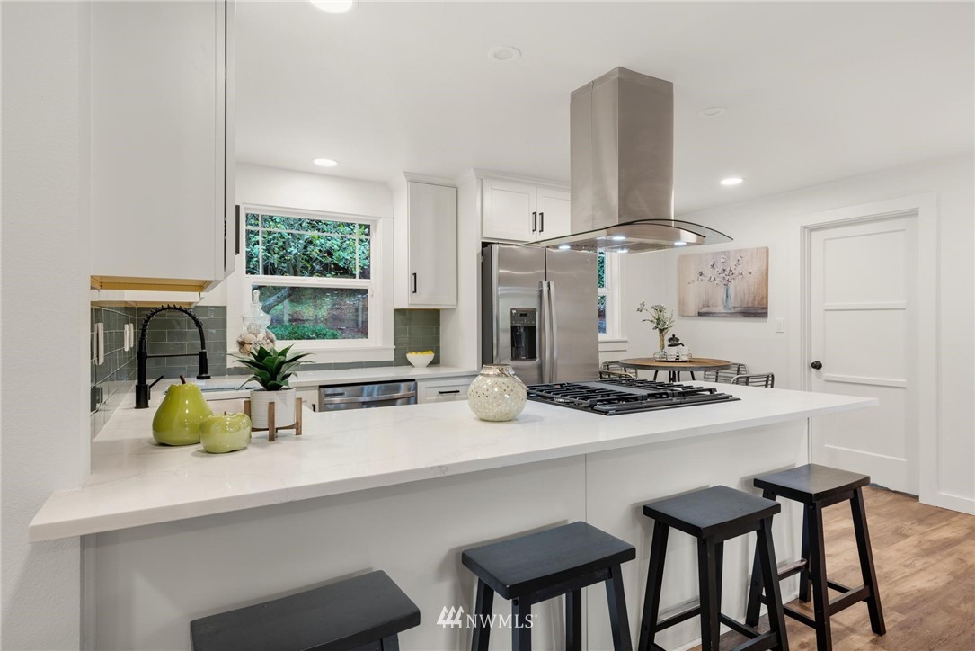 11519 32nd Avenue Northeast Seattle, WA 98125 - Photo 8 of 17 a kitchen with appliances a sink and cabinets