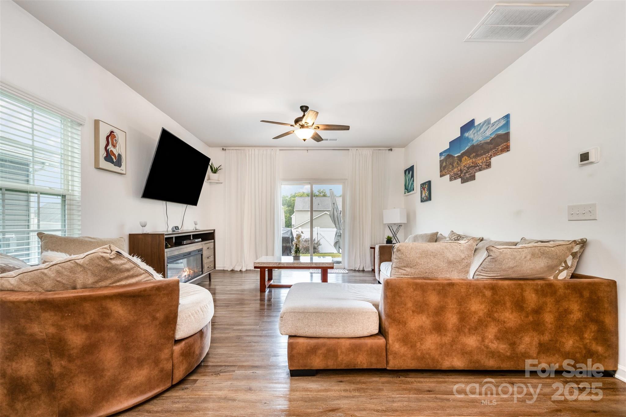 6883 Spring Peeper Lane Lancaster, SC 29720 - Photo 14 of 42 a living room with furniture and a flat screen tv