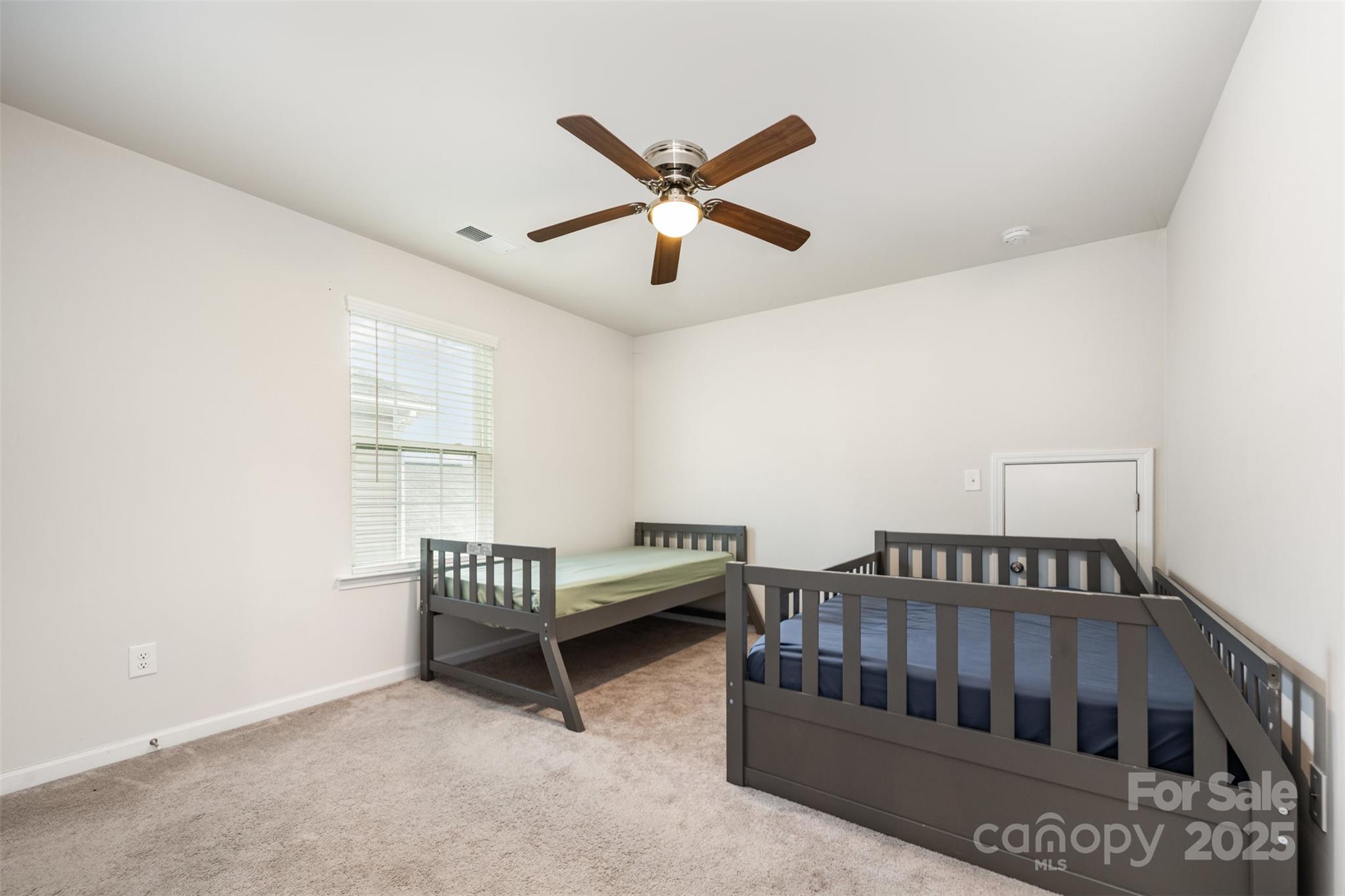 6883 Spring Peeper Lane Lancaster, SC 29720 - Photo 24 of 42 a bedroom with furniture and a window