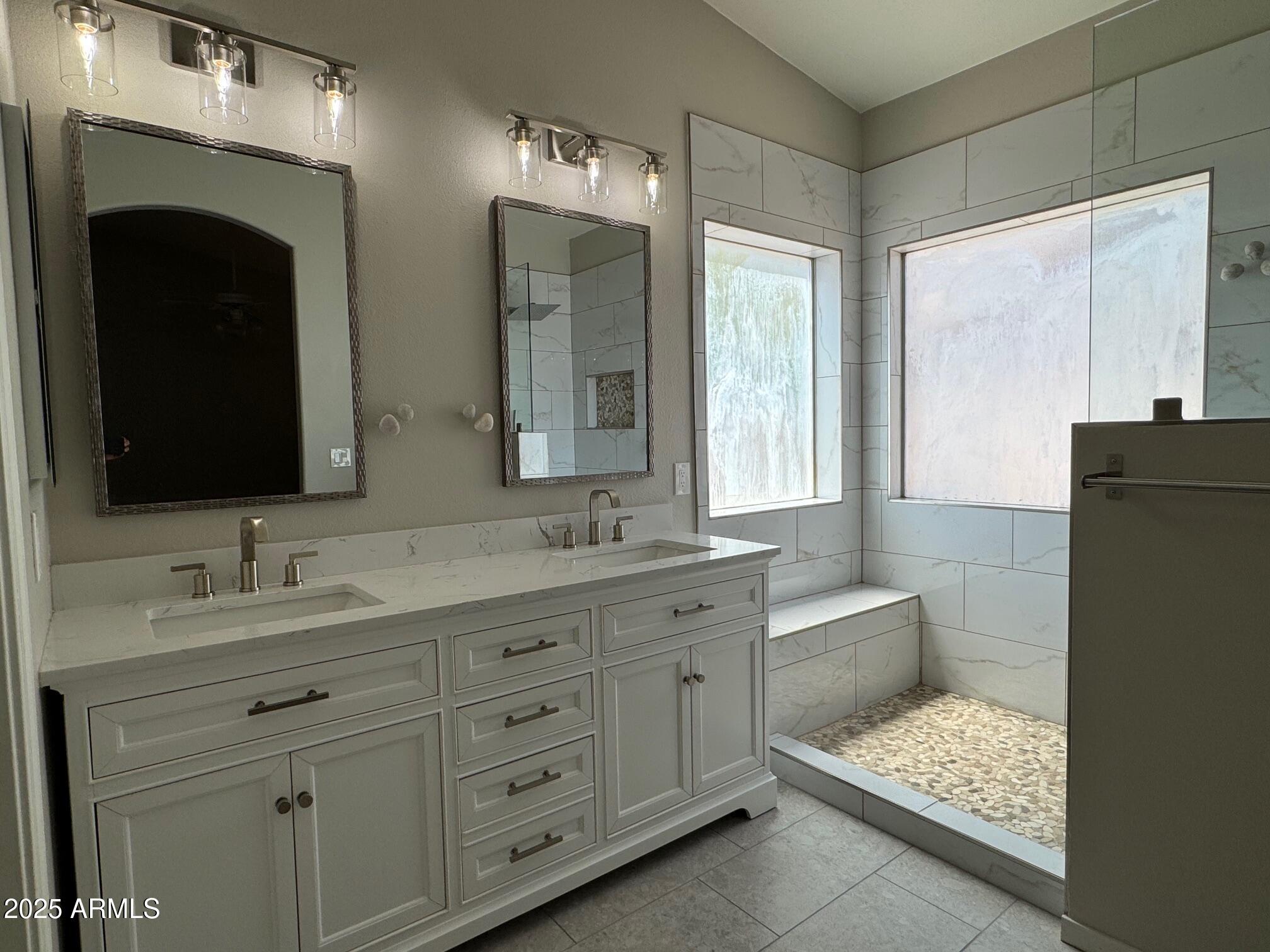 1822 South 39th Street, Unit 6 Mesa, AZ 85206 - Photo 15 of 18 a bathroom with a double vanity sink and mirror with shower