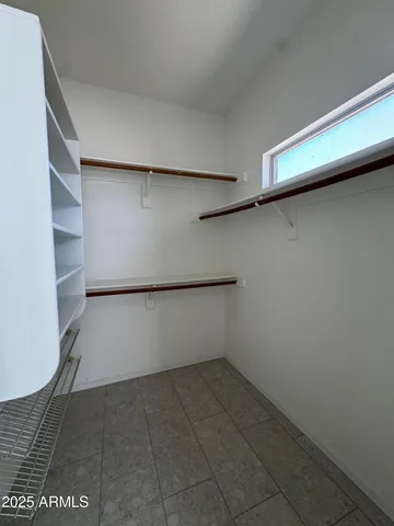 a view of an empty walk in closet