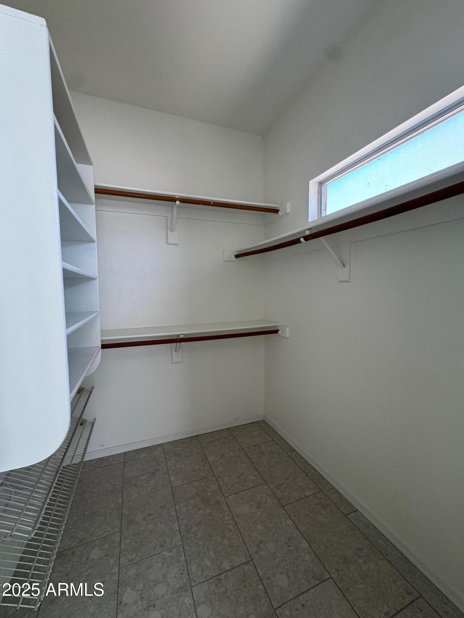 1822 South 39th Street, Unit 6 Mesa, AZ 85206 - Photo 16 of 18 a view of an empty walk in closet