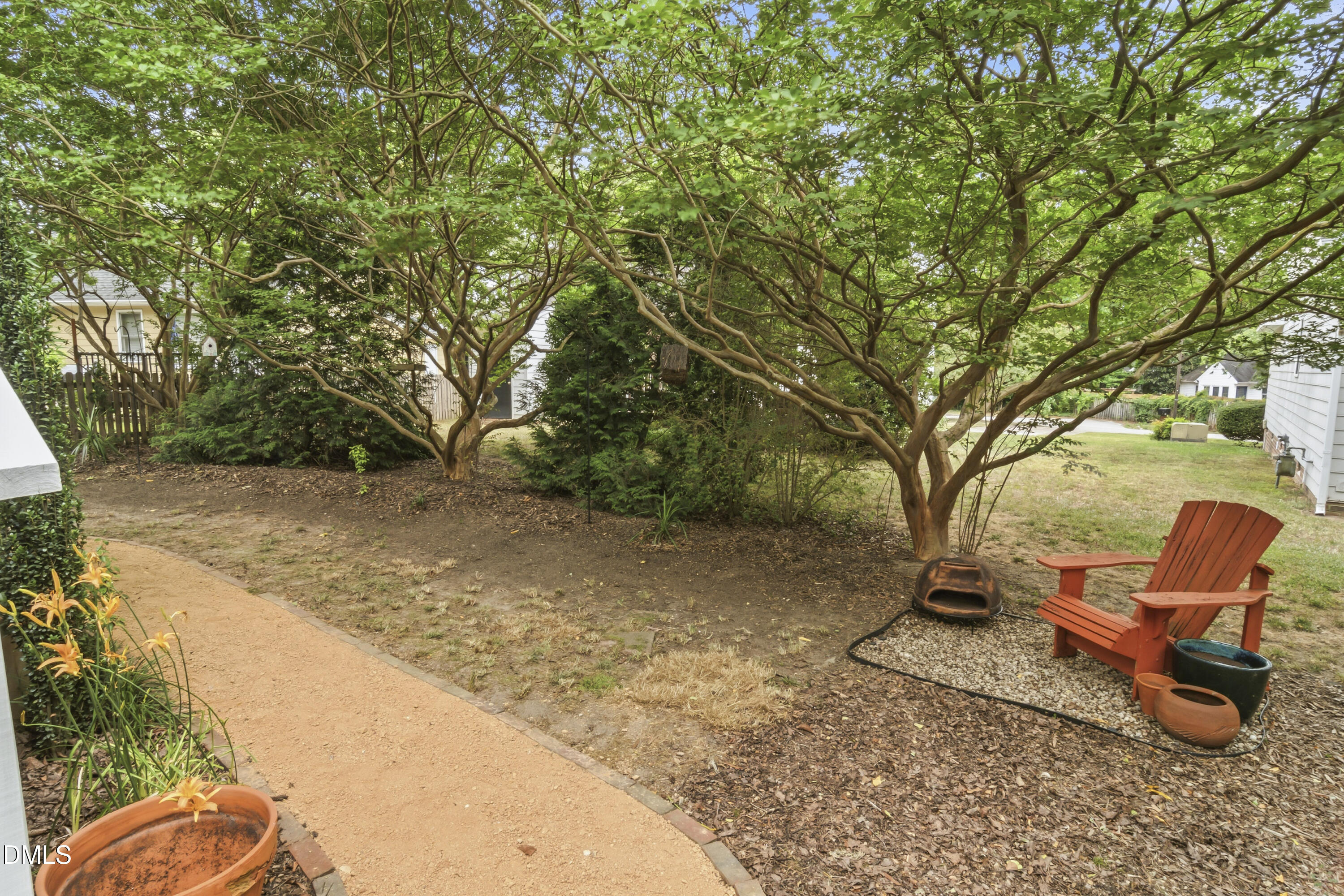 3004 West Annaley Drive Raleigh, NC 27604 - Photo 9 of 44 a backyard of a house with table and chairs