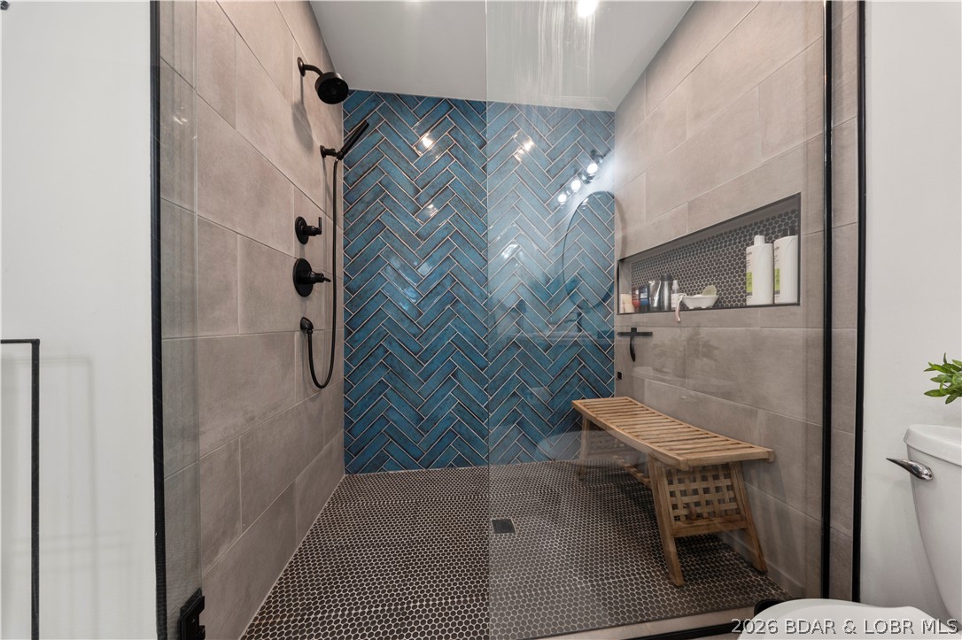 1151 Oak Road Osage Beach, MO 65065 - Photo 26 of 63 Luxurious walk-in shower featuring designer tile a