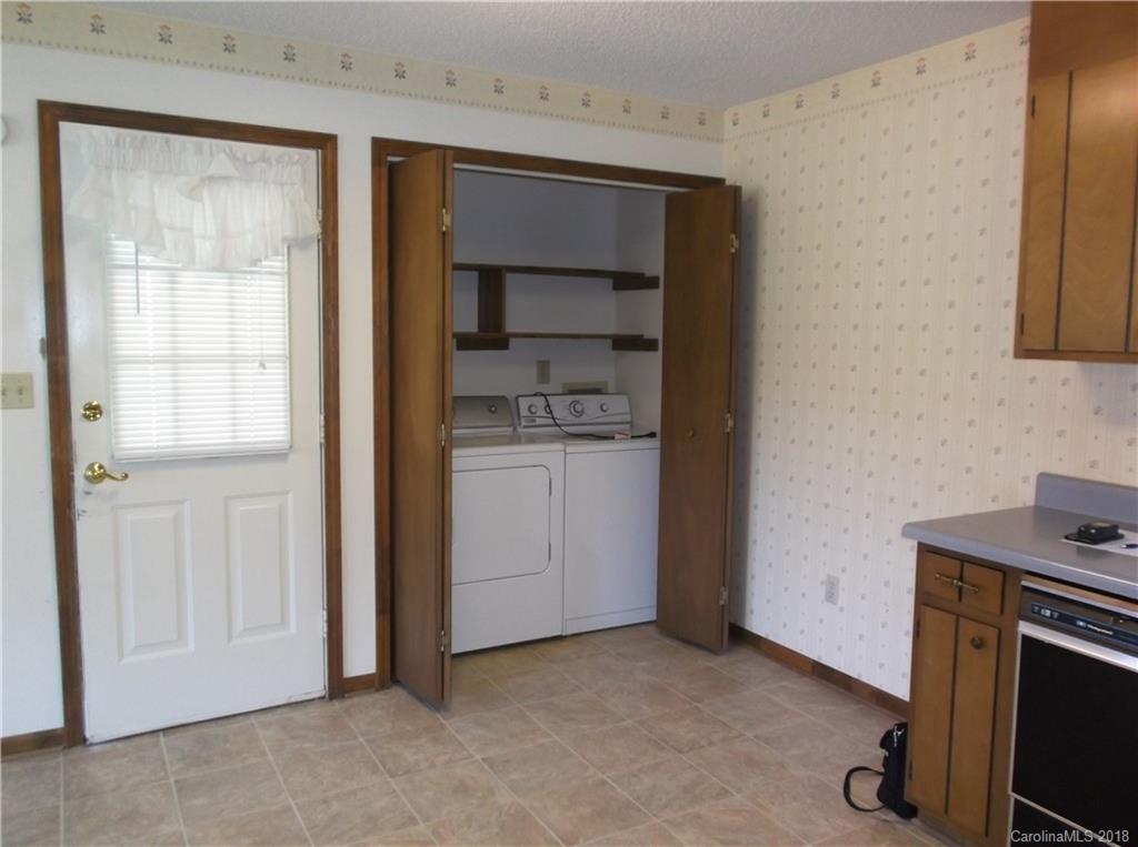 1835 Rainey Road Salisbury, NC 28146 - Photo 7 of 17 a view of a kitchen with cabinets and a stove top oven