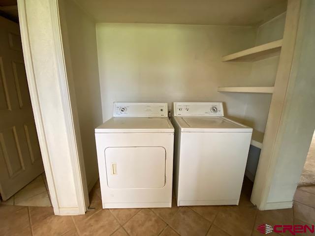 24502 Rd North Cortez, CO 81321 - Photo 12 of 35 a utility room with dryer and washer