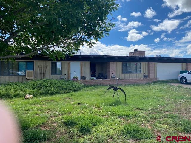 24502 Rd North Cortez, CO 81321 - Photo 3 of 35 a backyard of a house with lots of green space